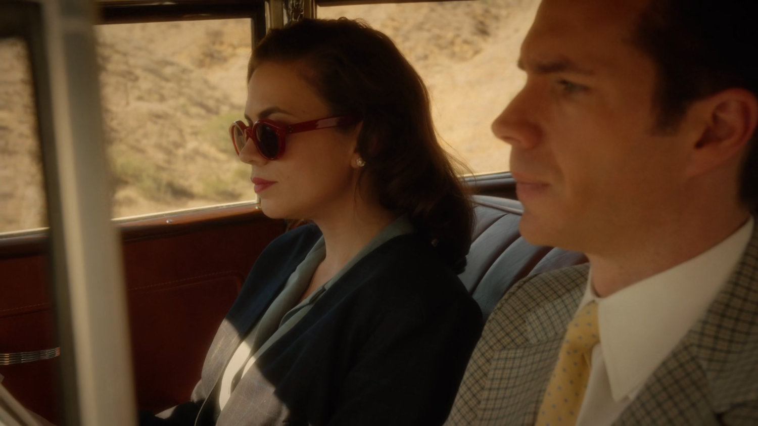 Peggy and Jarvis in car.
