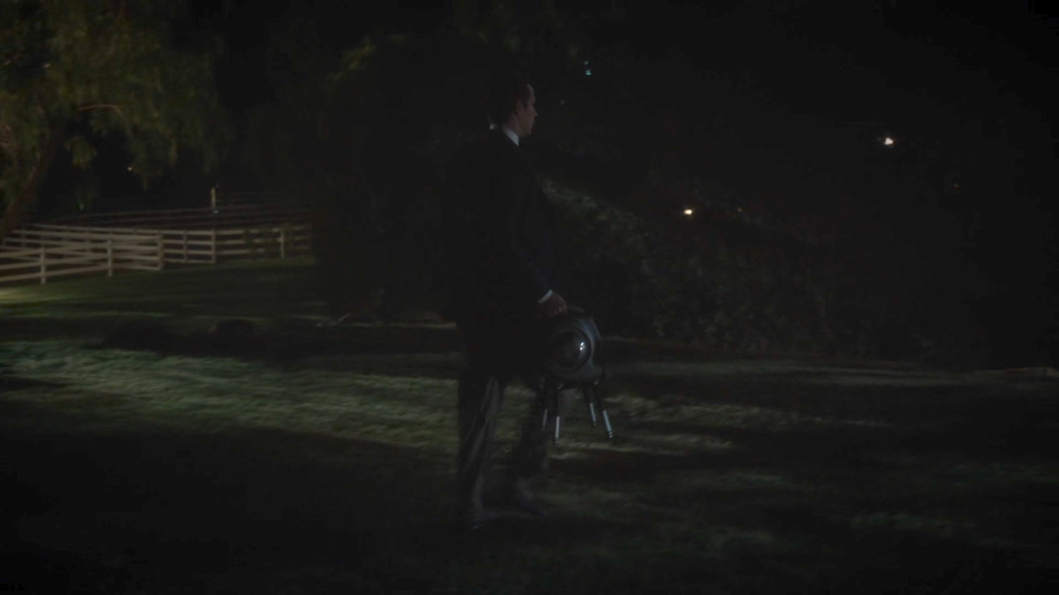 Jarvis walking across lawn at Chadwick Ranch at night.