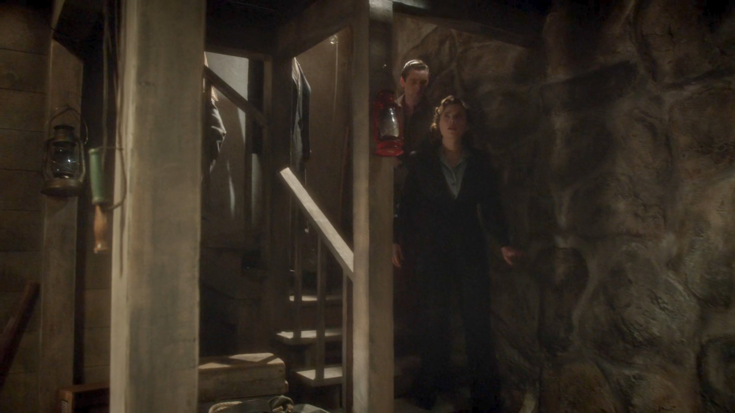 Peggy being escorted into Chadwick Ranch cellar.