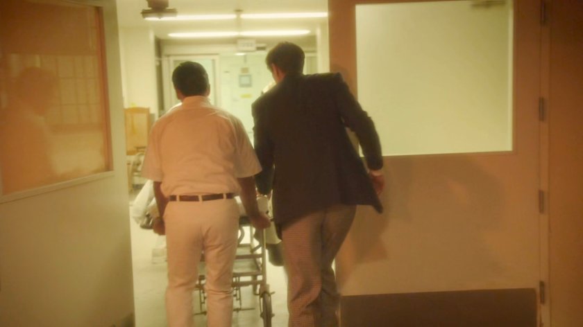 Jarvis and orderly rushing into Waverly Memorial Hospital at night.