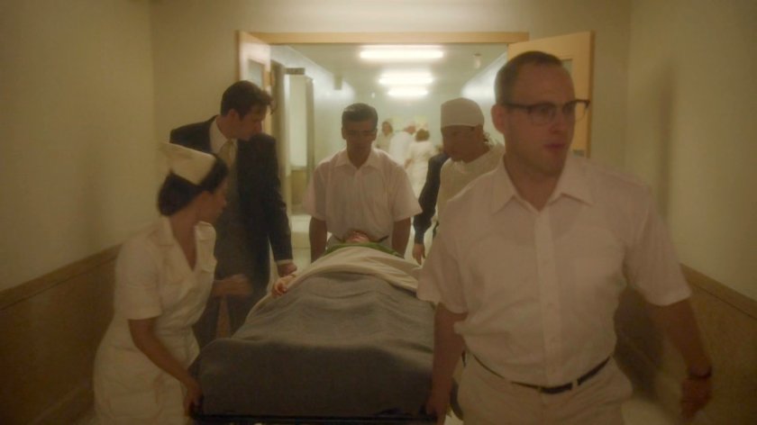 Jarvis walking with doctors and gurney inside Waverly Memorial Hospital.