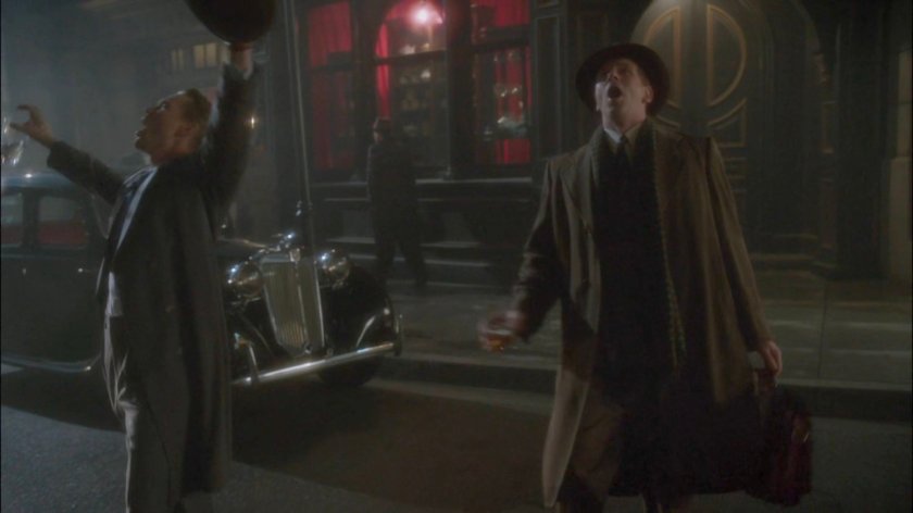 Thompson and Nick Driscoll cavorting drunkenly along street in London.