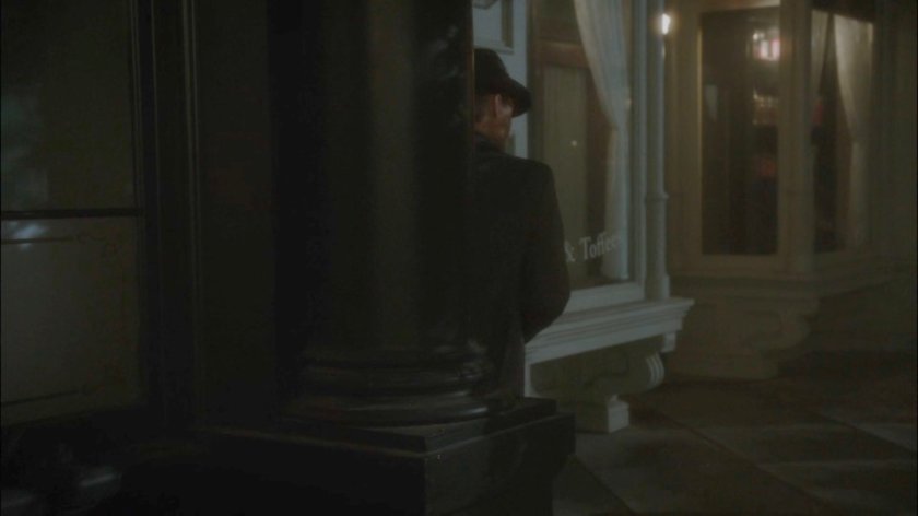 Thompson with a redacted dossier outside a pub in London.