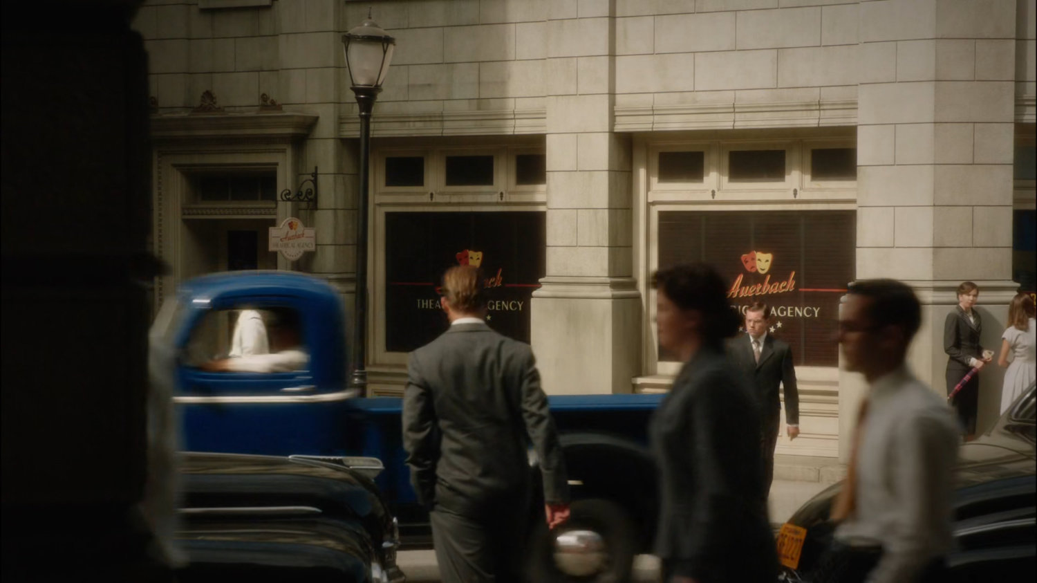 Exterior of Auerbach Theatrical Agency with pedestrians.