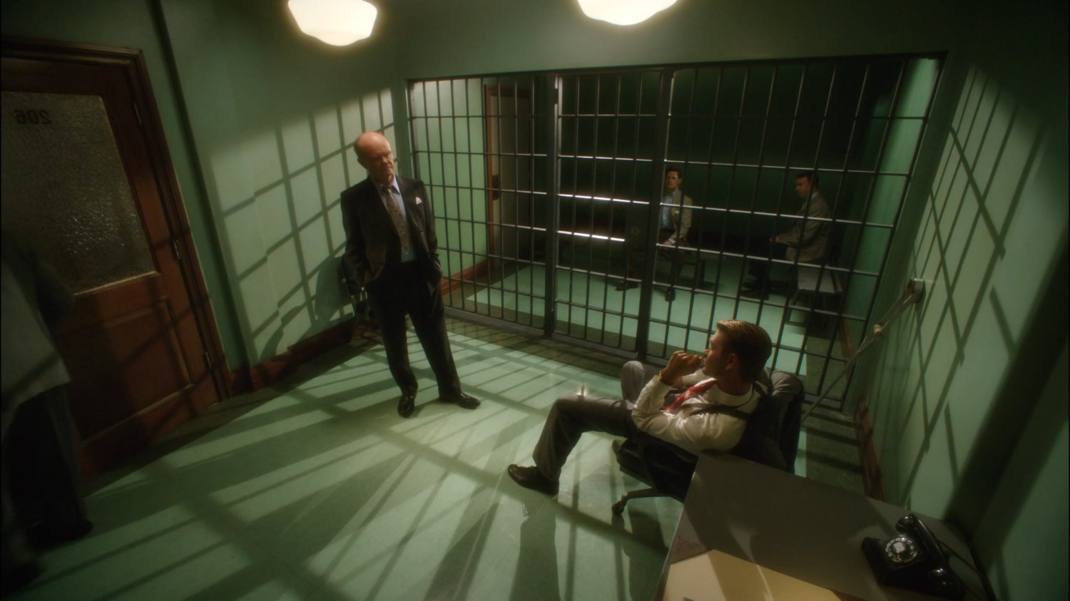 Thompson and Vernon looking at Sousa and Samberly in SSR cell.