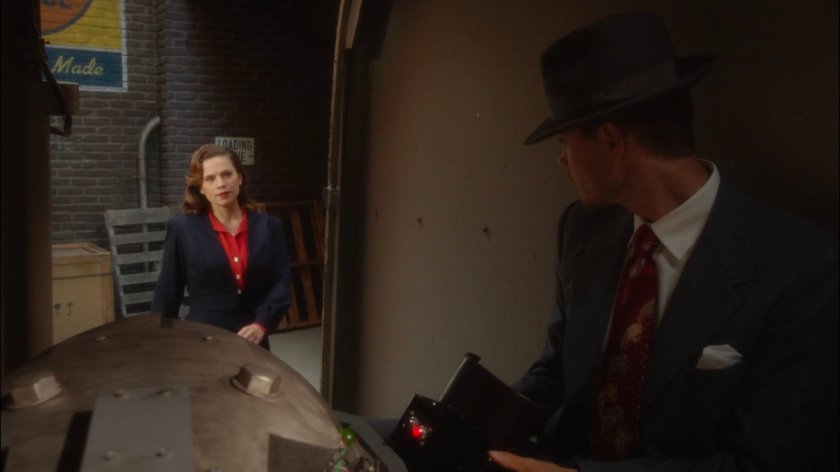 Peggy talking to Thompson in van outside Auerbach Theatrical Agency.