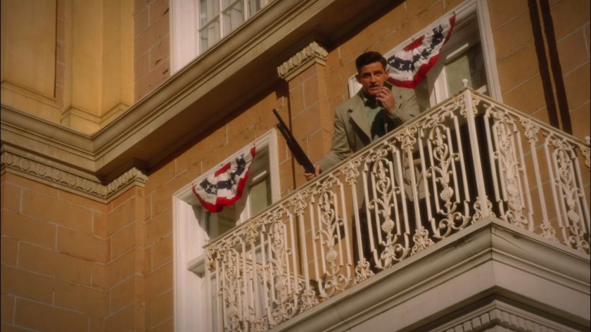 Sousa on balcony above town square on Stark Pictures backlot.