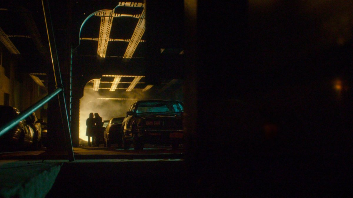 Couple in flagrante delicto under bridge.