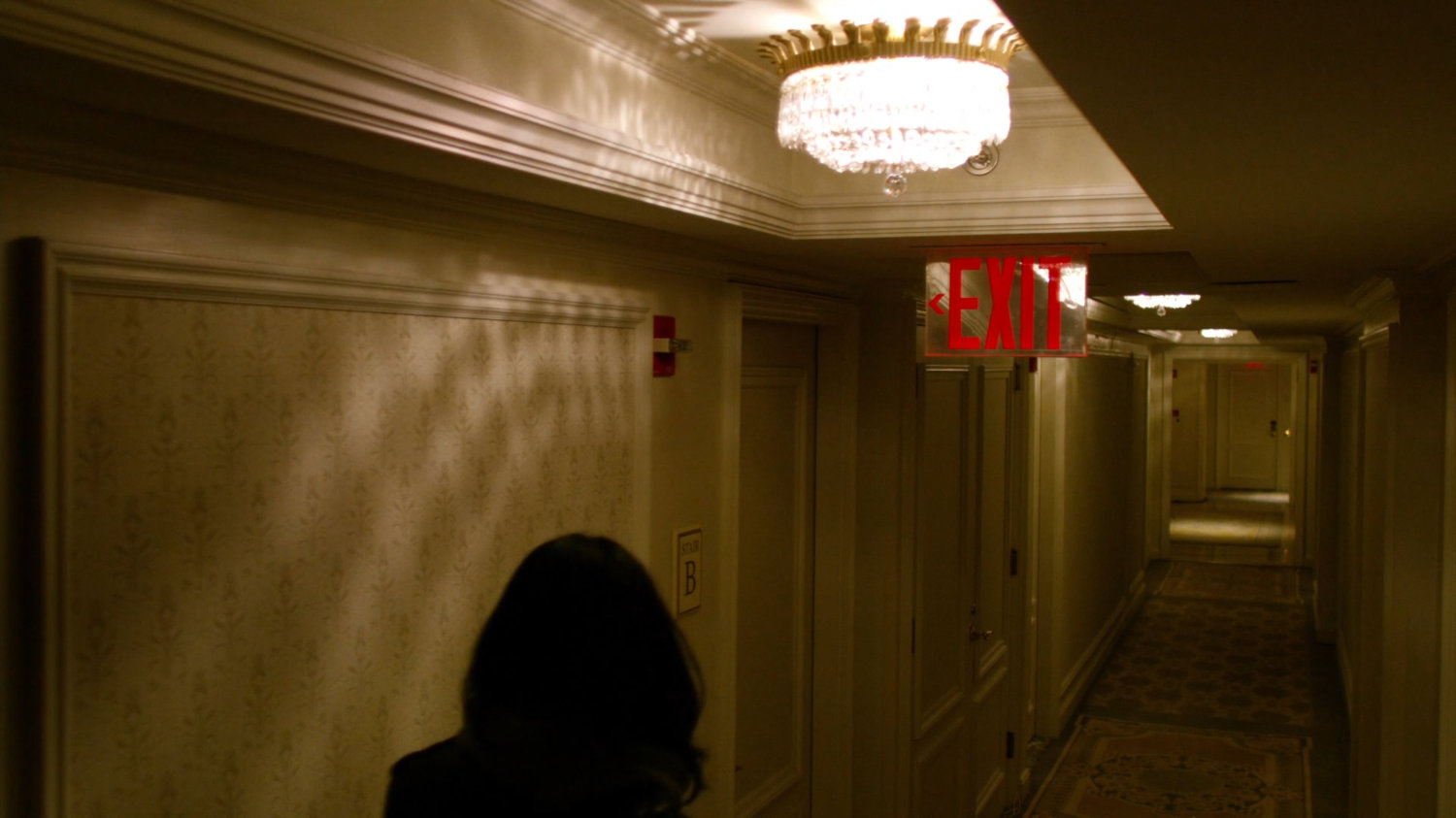 Jessica in a fancy hotel hallway.