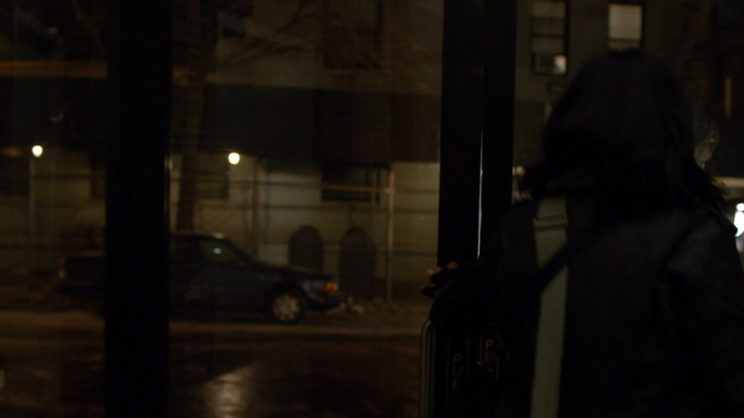 Jessica exiting Alias Investigations building.