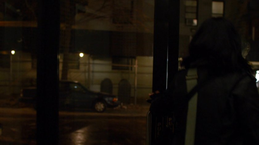 Jessica exiting Alias Investigations building.