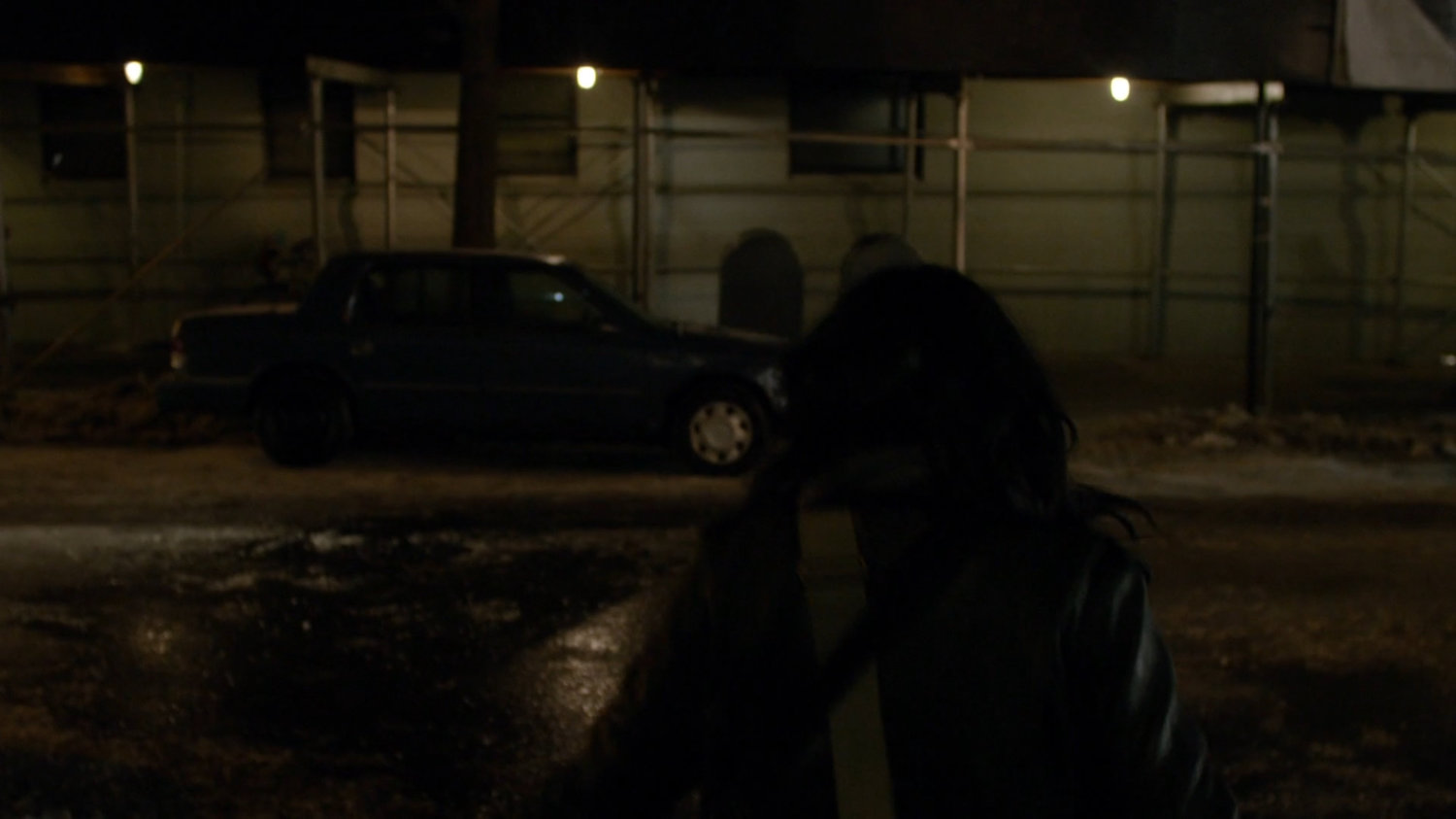 Jessica exiting Alias Investigations building.