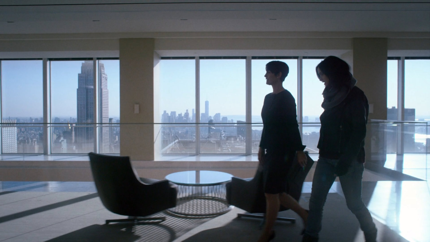 Jeri and Jessica walking in the lobby of Hogarth, Chao, & Benowitz.