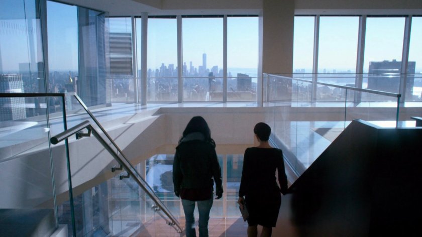 Jeri and Jessica descending stairs at Hogarth, Chao, & Benowitz.