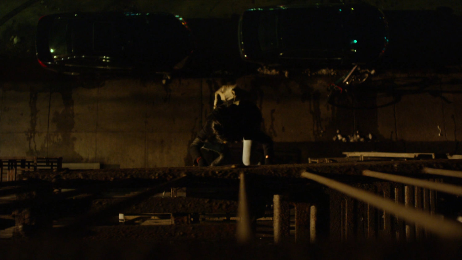 Jessica climbing fire escape across from Luke's bar.