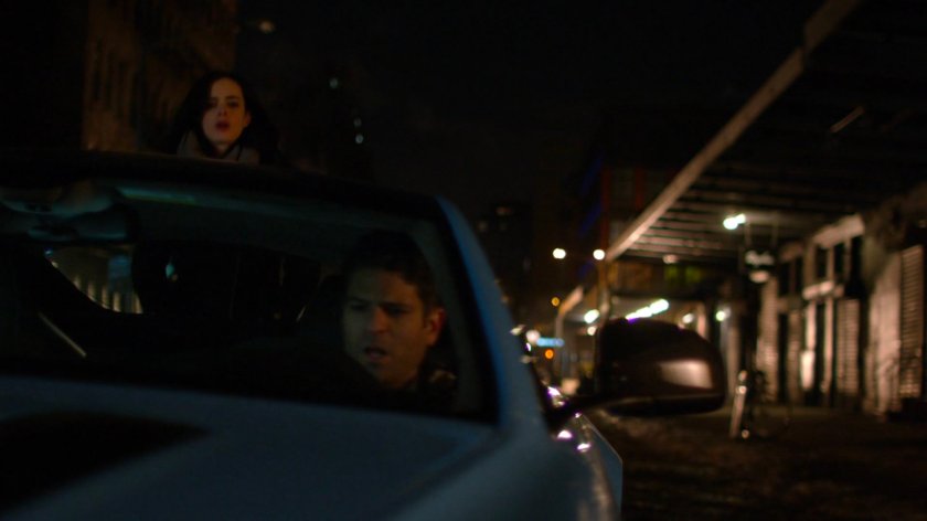 Jessica lifting Spheeris' car.