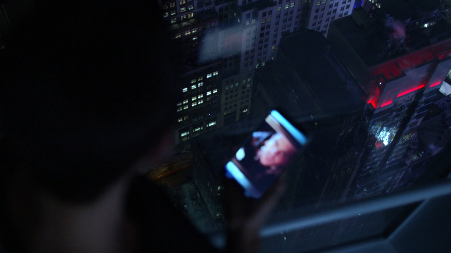 Jeri on phone with Jessica at Hogarth, Chao, & Benowitz, nighttime.