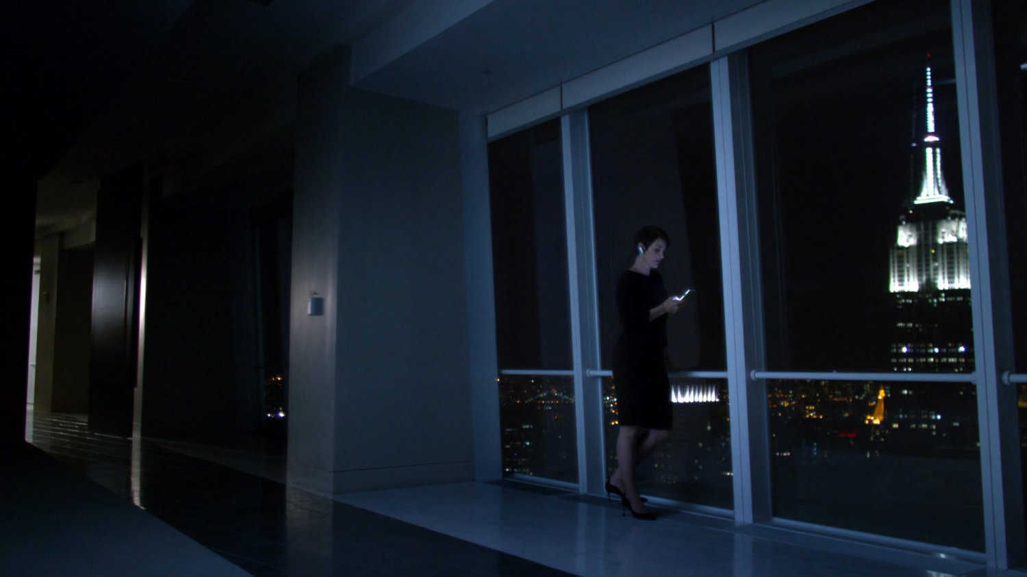 Jeri on phone with Jessica at Hogarth, Chao, & Benowitz, nighttime.