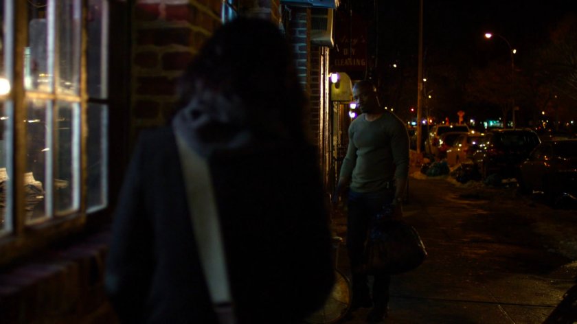 Jessica talking to Luke on sidewalk outside his bar.