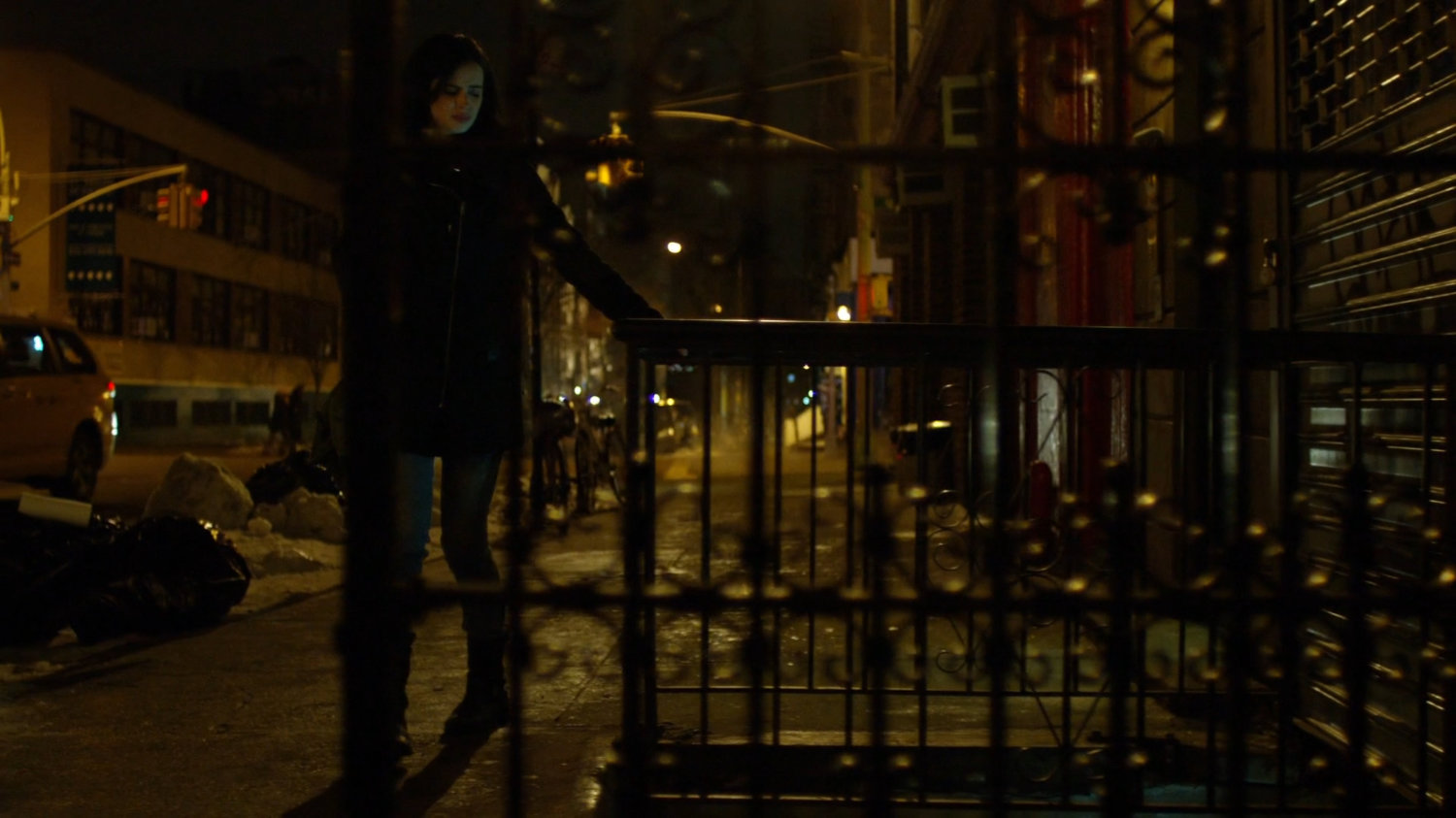 Jessica on sidewalk outside Luke's apartment.