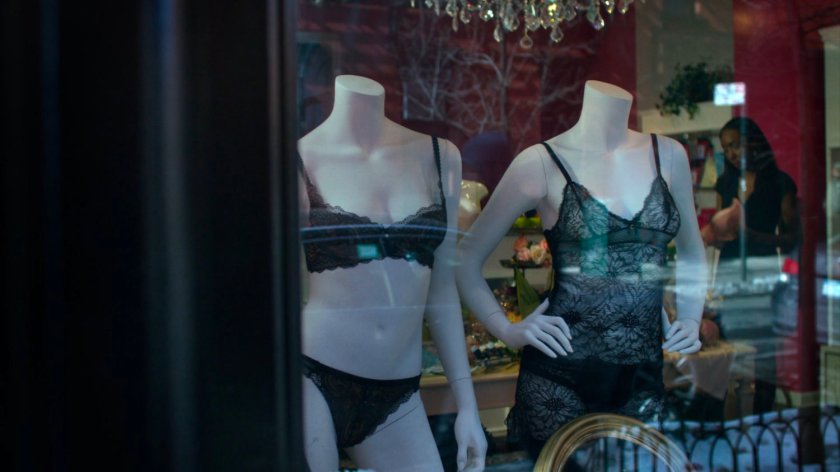 Mannequins in the front window of lingerie shop.