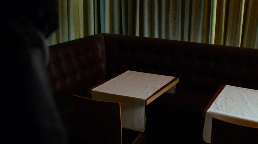 Empty corner table inside Niku Japanese restaurant.