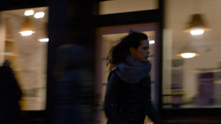 Jessica running along sidewalk.