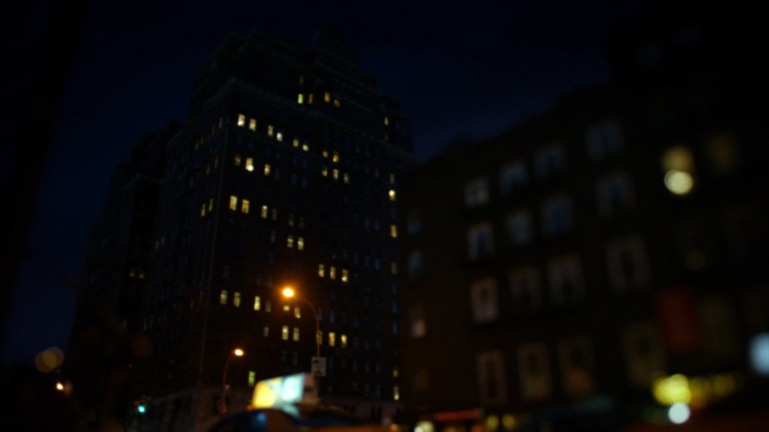 Nighttime view of Trish Walker's building.
