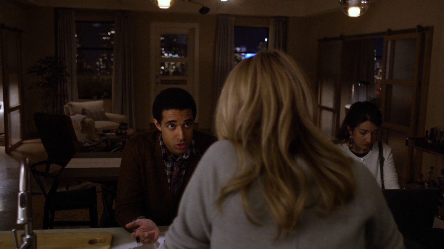 Trish Walker and friends inside her apartment.