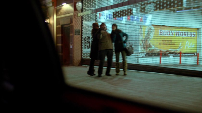View of Body Worlds exhibit from taxi at night.