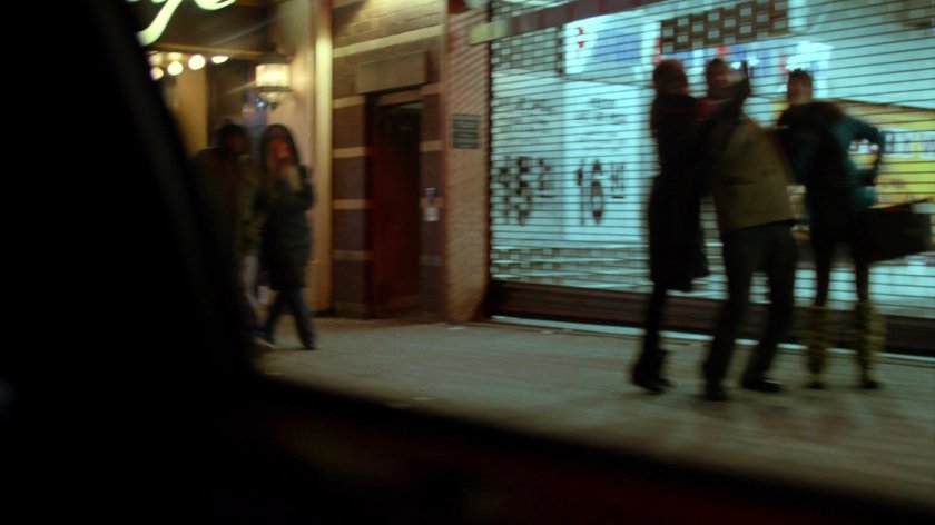 View of Body Worlds exhibit from taxi at night.