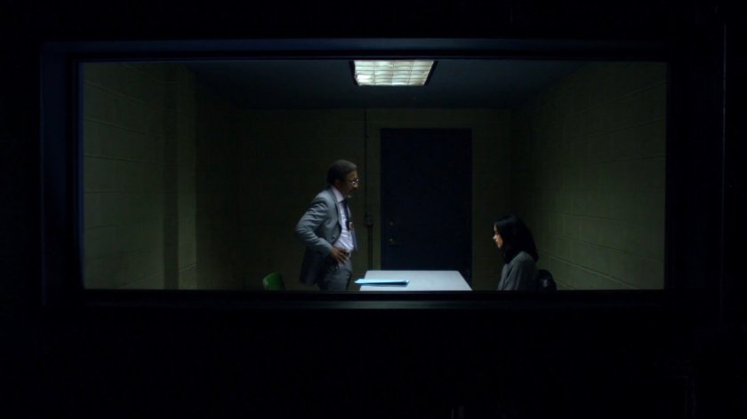 Detective Clemons with Jessica in a police interrogation room.