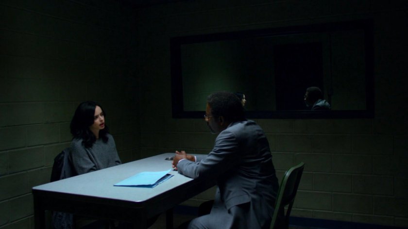 Detective Clemons with Jessica in a police interrogation room.