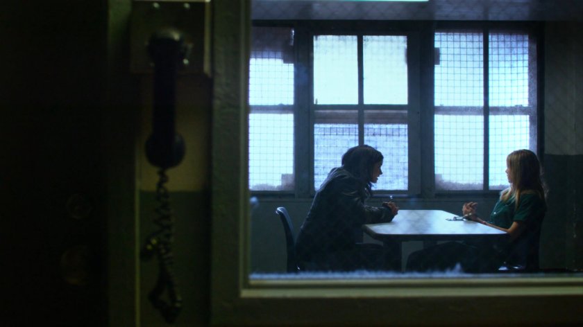 Jessica and Hope in a correctional facility room.