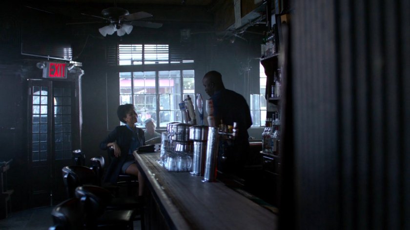 Gina and Luke in his bar.