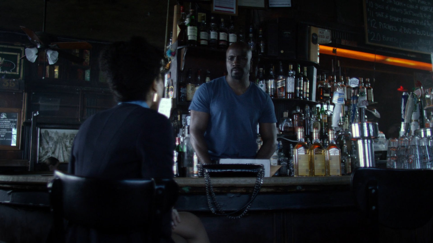 Gina and Luke in his bar.