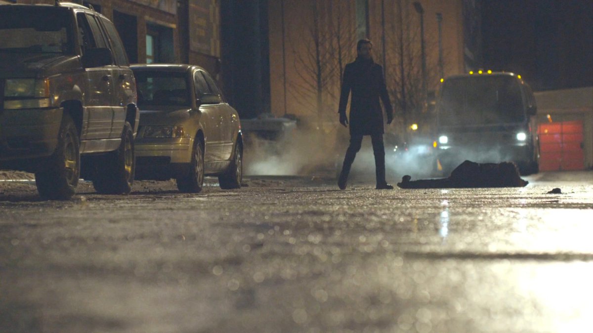 Kilgrave in street with oncoming bus.