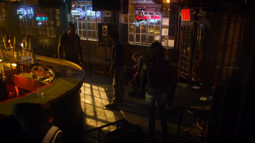 Luke and Jessica cleaning up after fight in his bar.