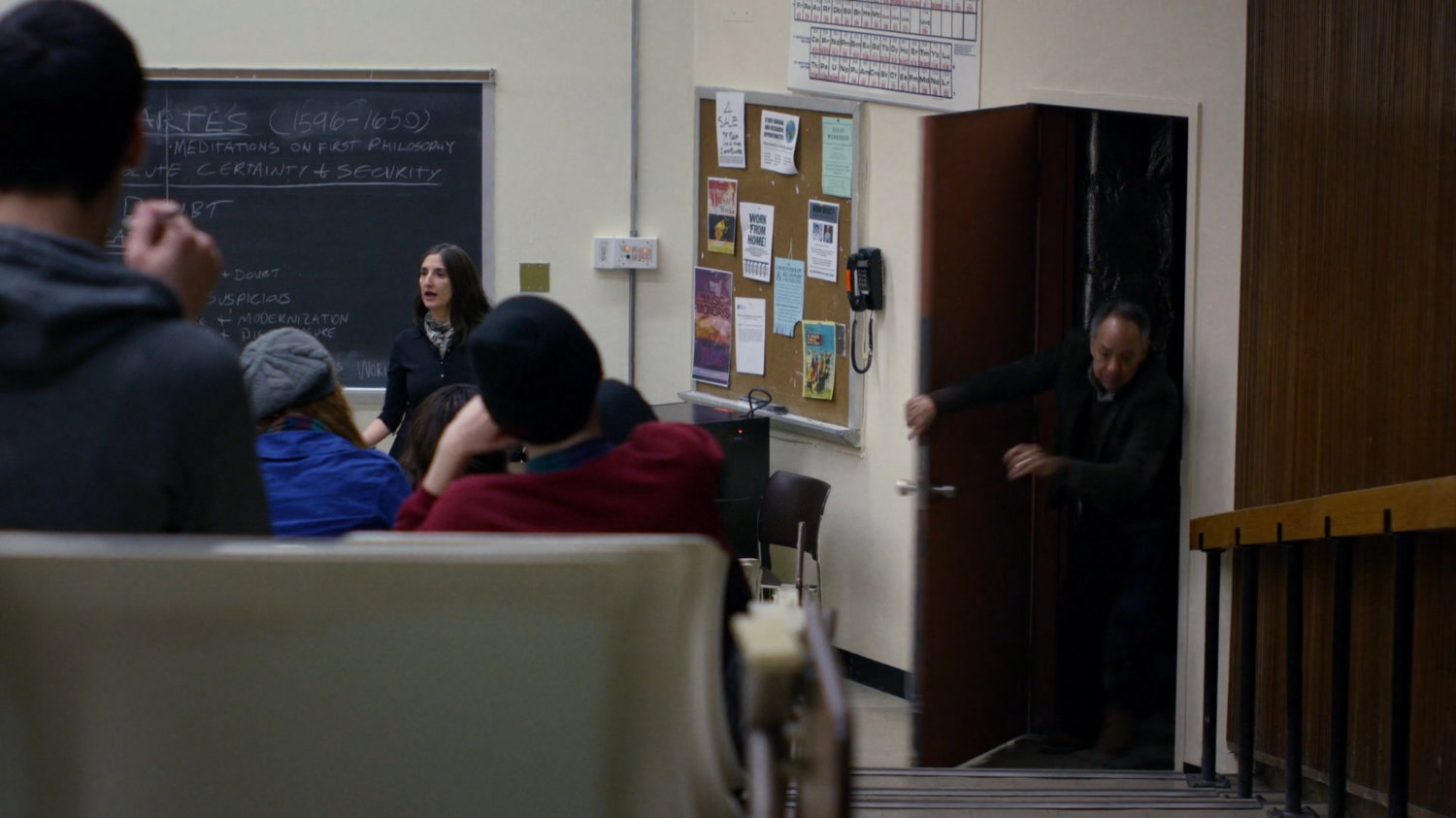 David Kurata running through a classroom.