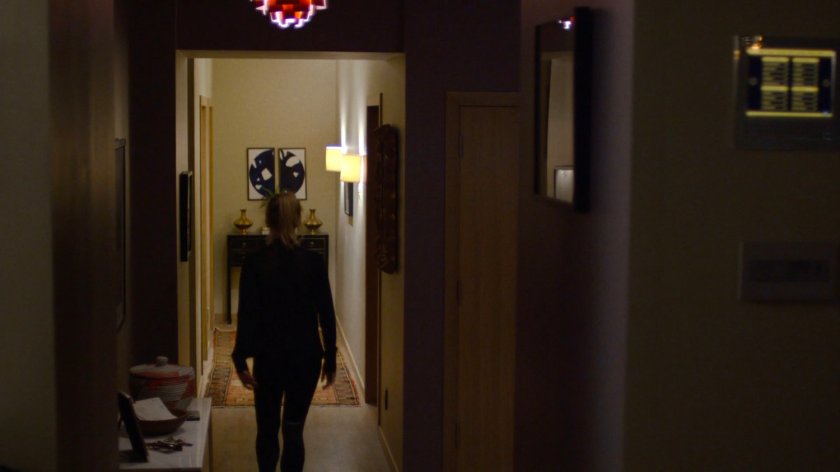 Trish Walker in her apartment hallway.