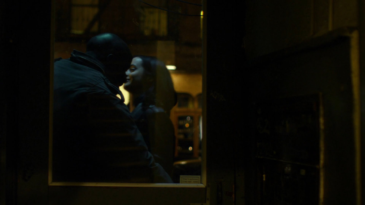 Luke and Jessica walking into his apartment building.