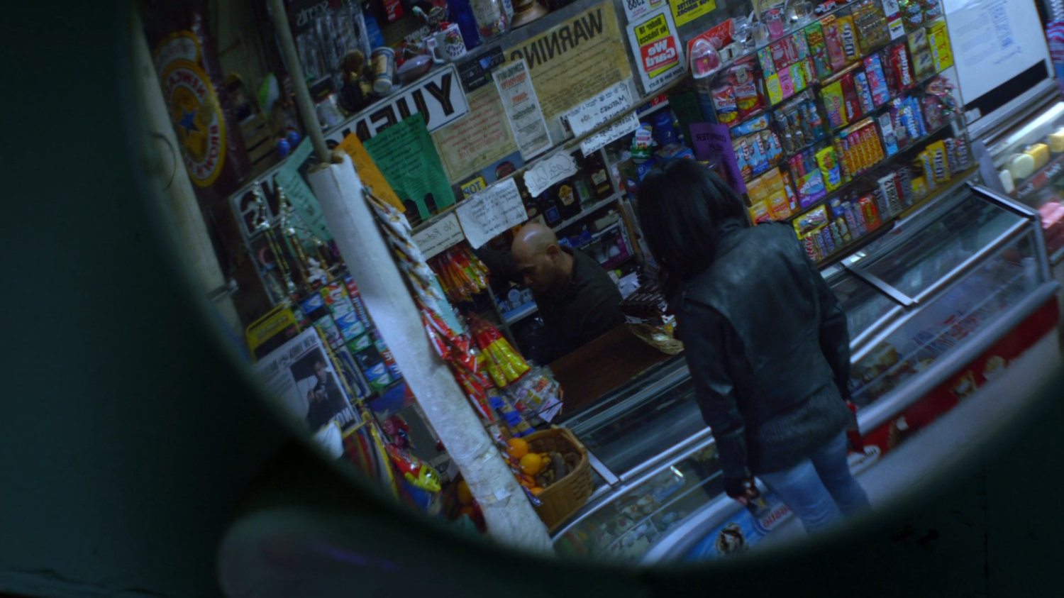 Jessica with cashier in a corner store.