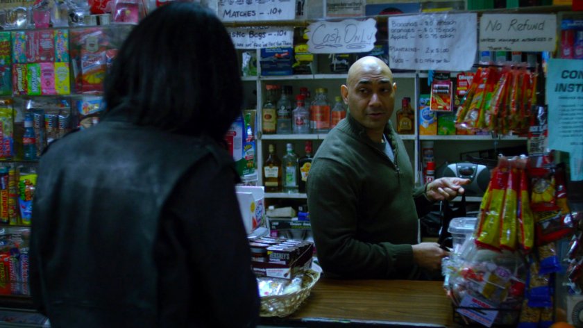 Jessica with cashier in a corner store.