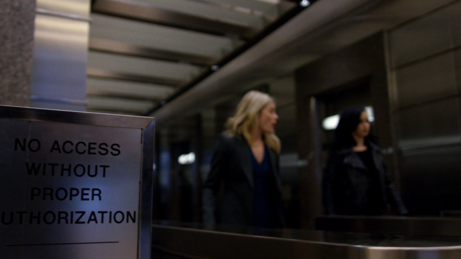 Trish and Jessica walking through WNEX lobby.