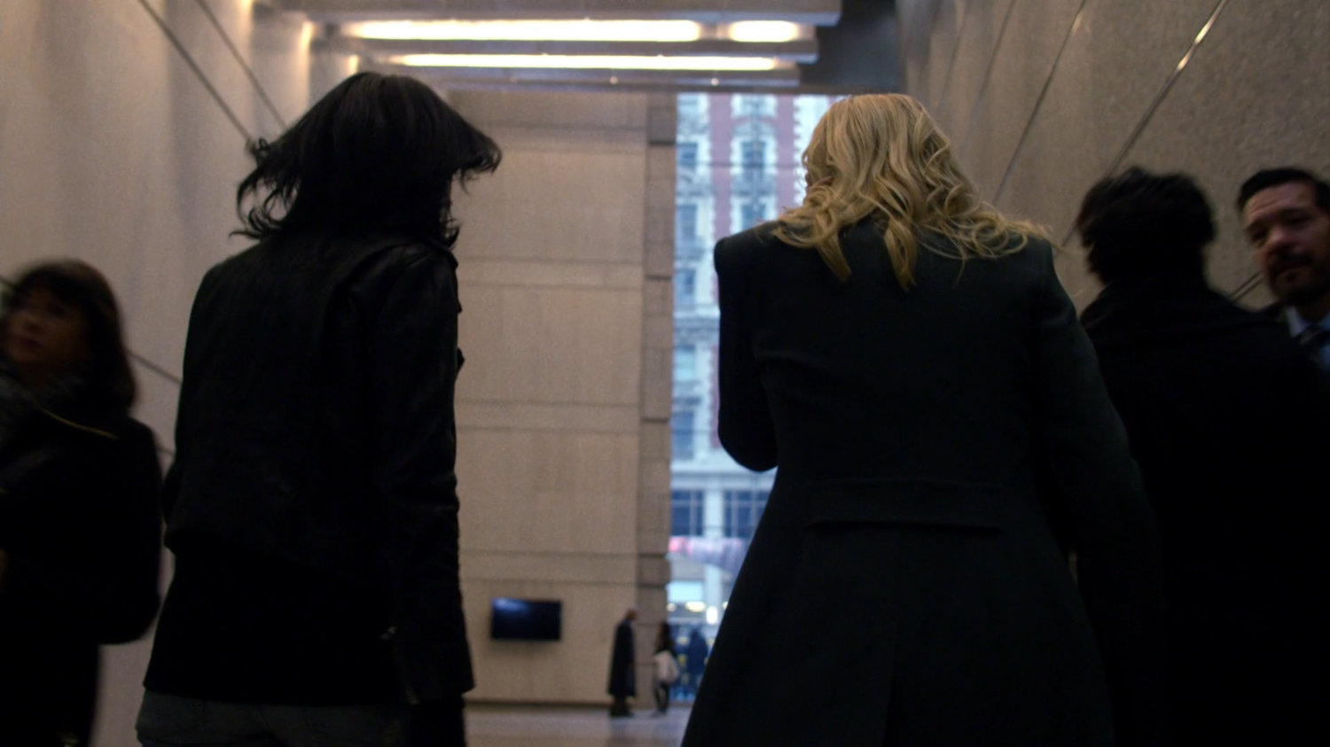 Trish and Jessica walking through WNEX lobby.