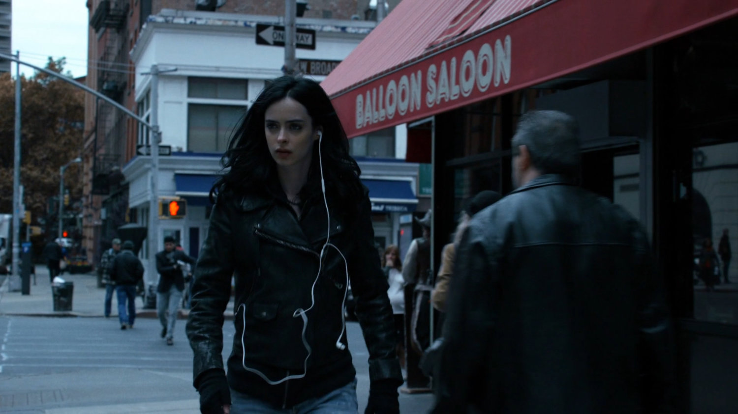Jessica walking along a Tribeca sidewalk.