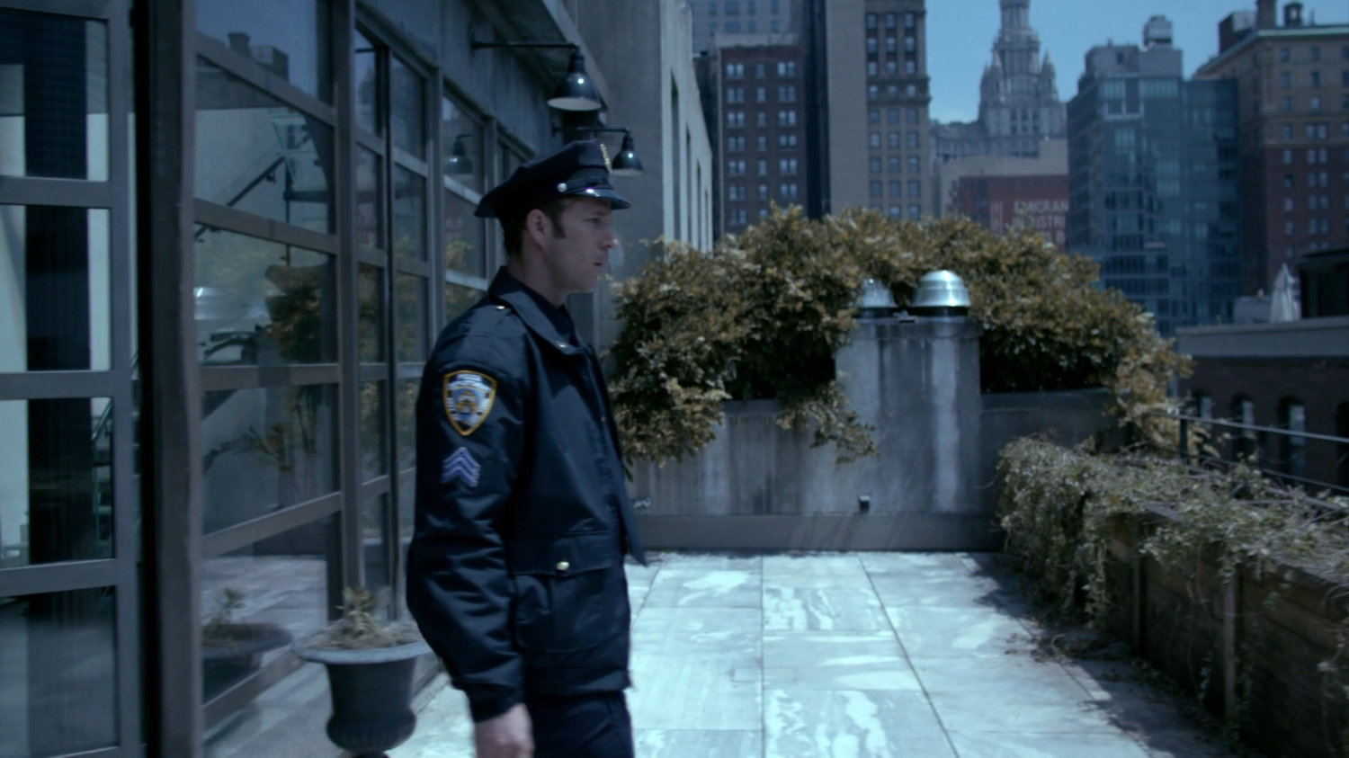 Officer Simpson on balcony.