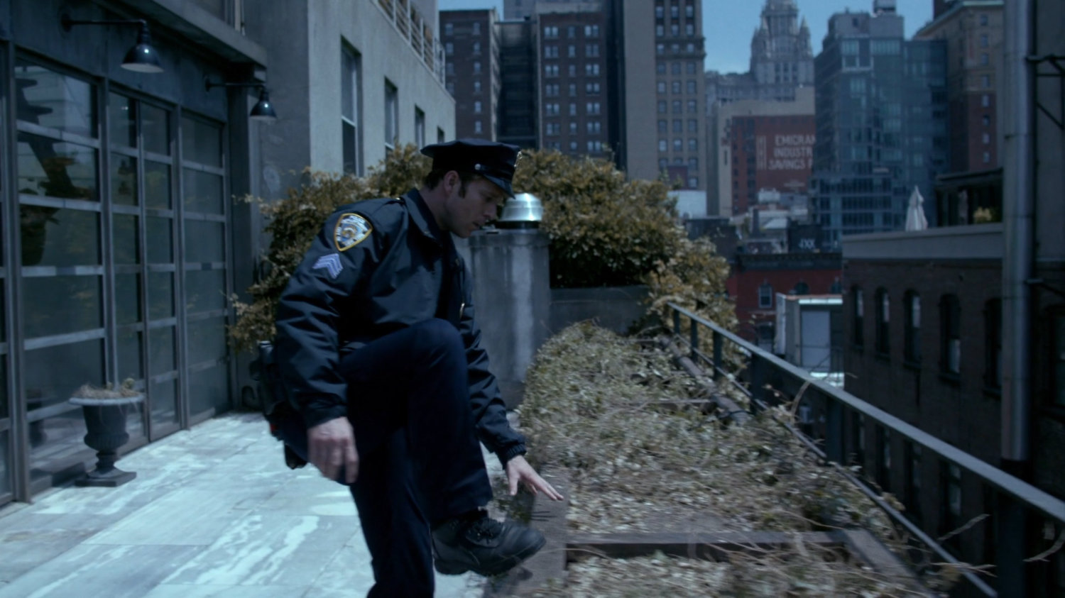 Officer Simpson on balcony.