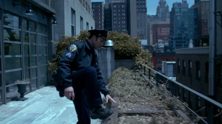Officer Simpson on balcony.