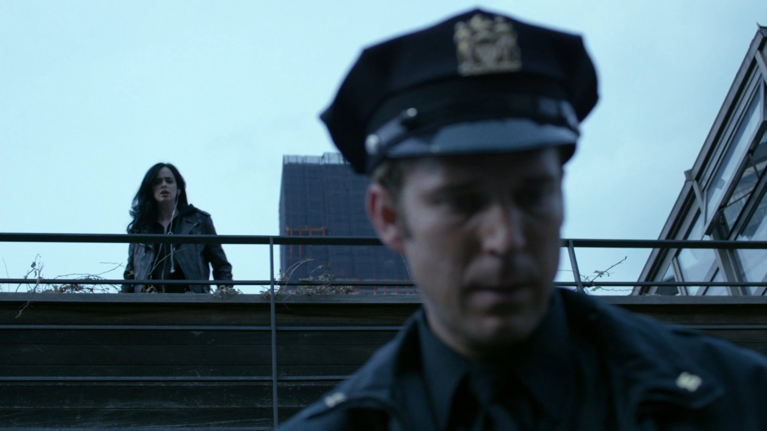 Jessica watching Officer Simpson on balcony.